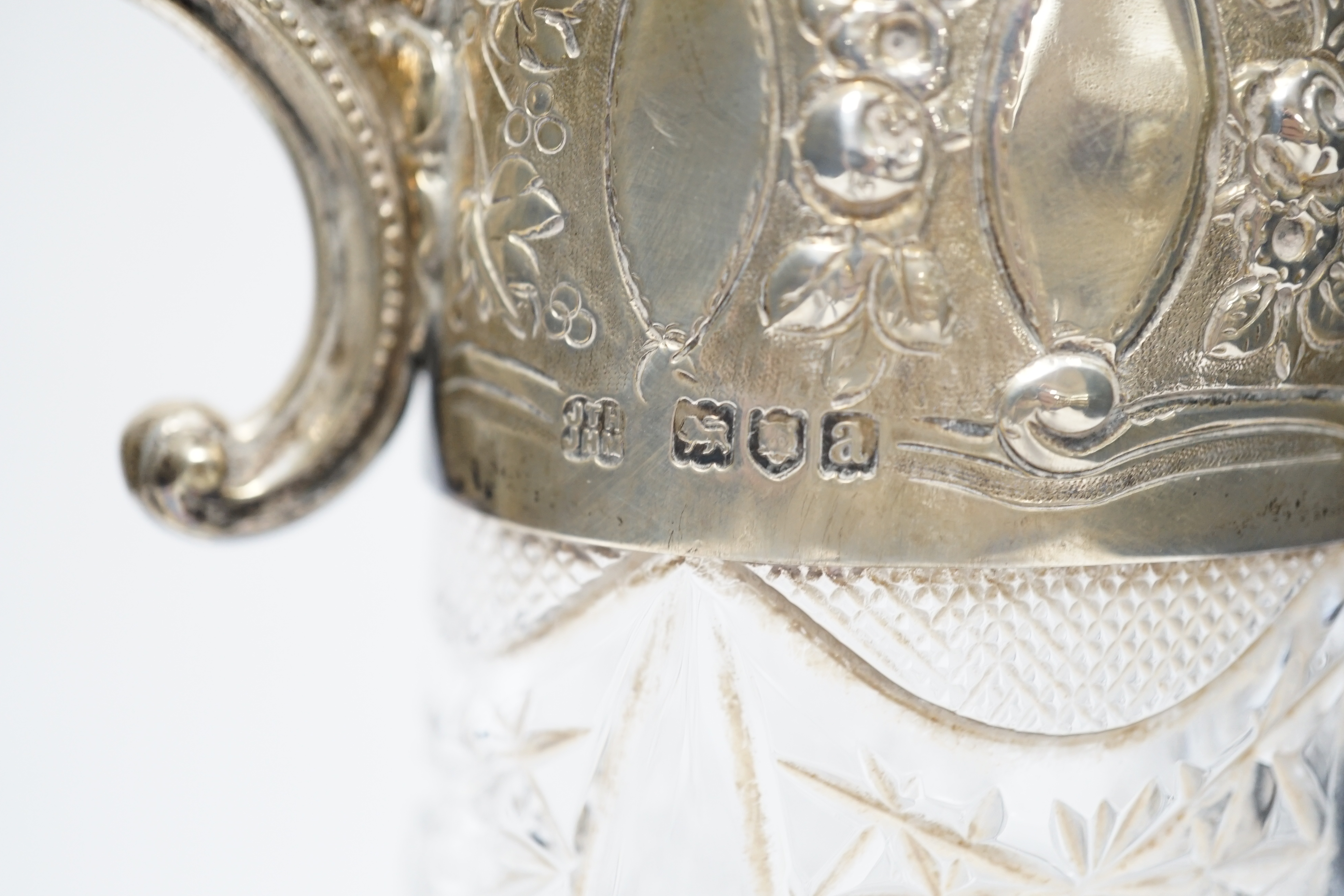 A late Victorian silver mounted cut glass claret jug, Hukin & Heath, London, 1896, 27.8cm.